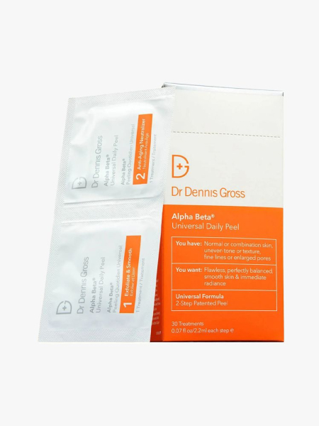 Dr. Dennis Gross Skincare Alpha Beta Extra Strength Daily Peel Pads white sachets of faical peels and orange and white box on light gray background
